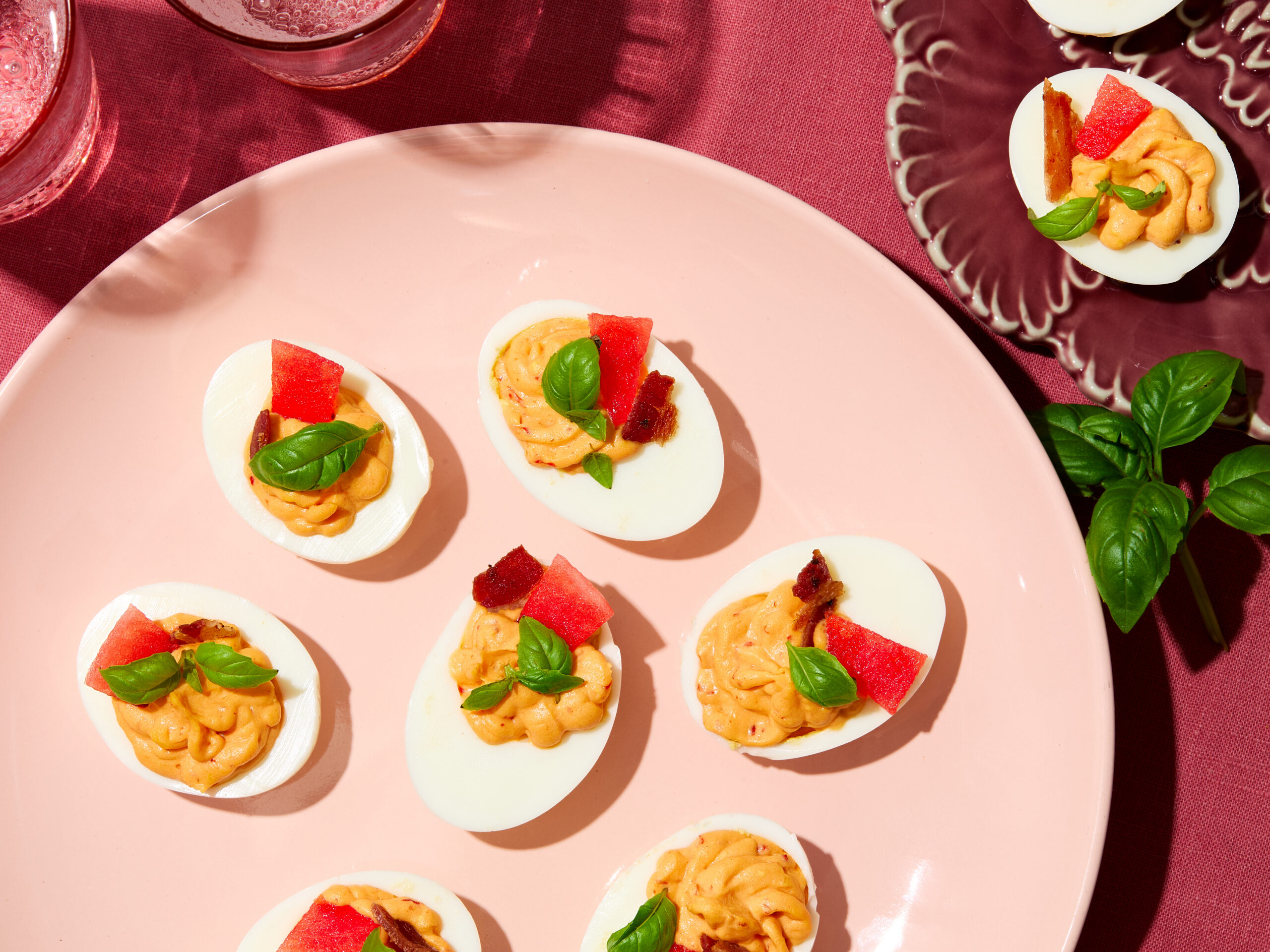Prosciutto e Melone Deviled Eggs with Calabrian chili cream, crispy prosciutto, melon and fresh herbs